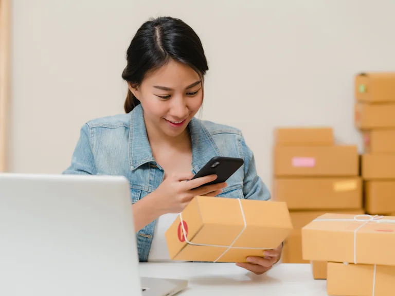 Team member checking a parcel before it ships
